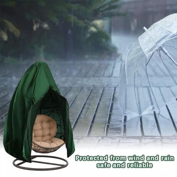 A green hanging chair with a rain cover in front of it.