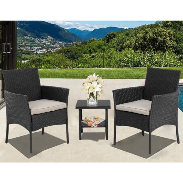 A black wicker patio set with table and chairs.