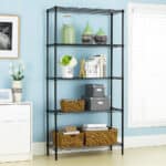 A black, multi-shelf storage unit organized with decorative items, books, and storage baskets against a light blue wall.