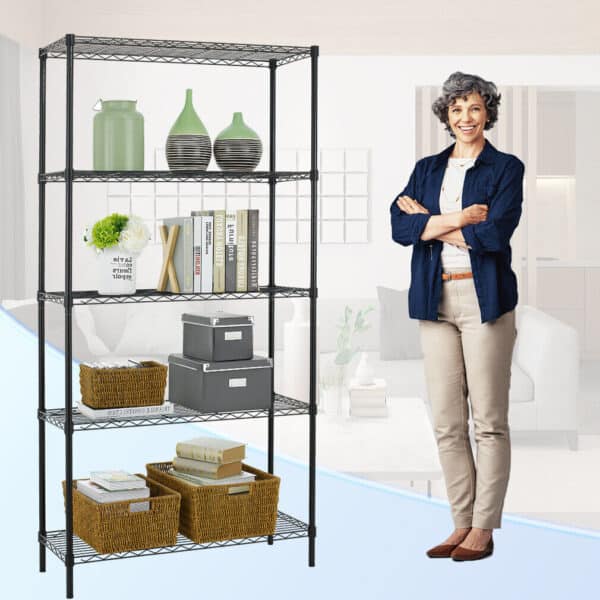 A smiling woman with crossed arms standing next to a shelving unit organized with books, decorative items, and storage baskets.
