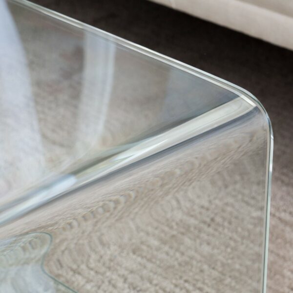 A close up of a glass coffee table.