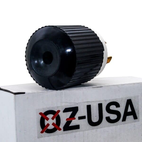Black and silver electronic component mounted on a gray box with the label "x-usa" and a red prohibition sign.