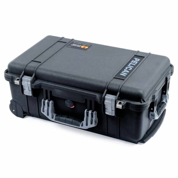Black pelican hard case with a sturdy handle and pressure release valve.