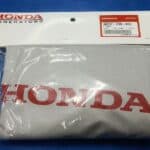 A packaged honda-branded item on a blue surface.