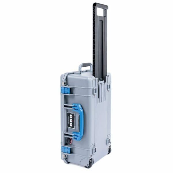 Hard-shell protective rolling equipment case with telescoping handle and durable latches.