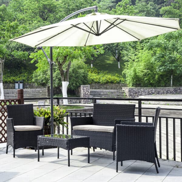Outdoor seating area with black wicker furniture and a large umbrella.