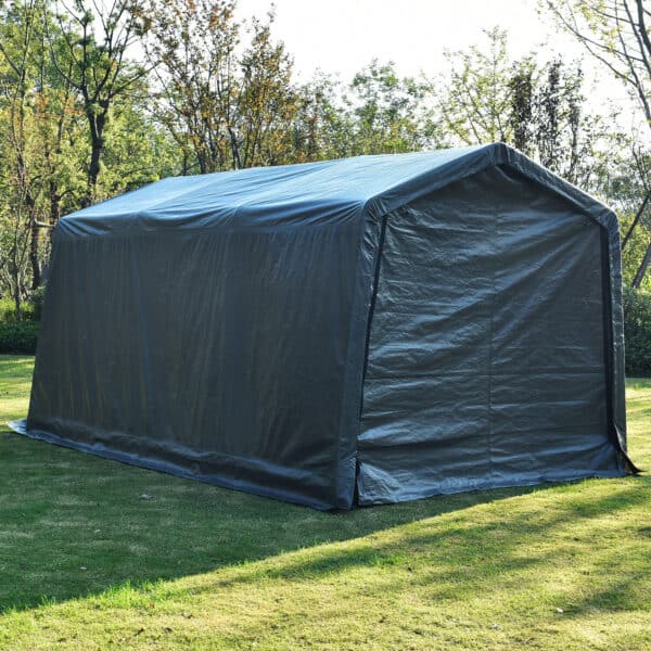 Portable garage tent set up on grass.