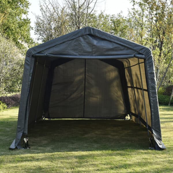 A portable black canopy tent set up on grass.