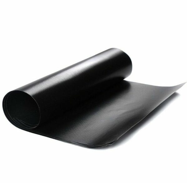 A roll of black material, possibly vinyl or leather, unrolling on a white background.