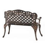 An outdoor bench with an ornate design.