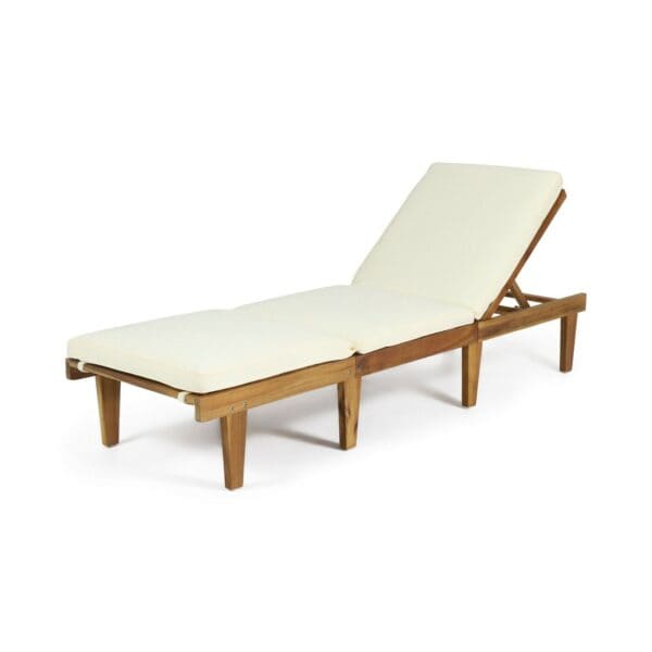 A wooden chaise lounge with a white cushion.