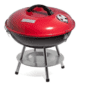 A red and black bbq grill on a stand.