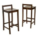 Two wooden bar stools on a white background.