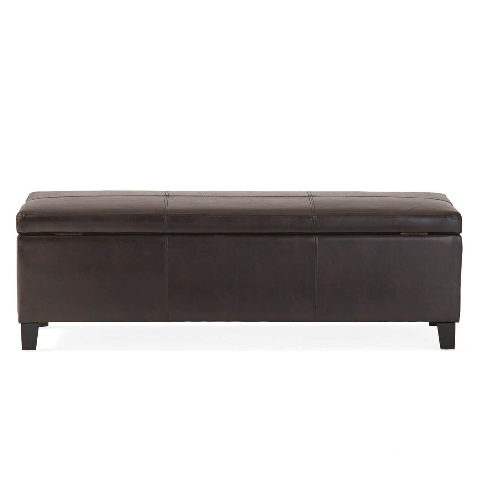 A brown leather storage bench on a white background.