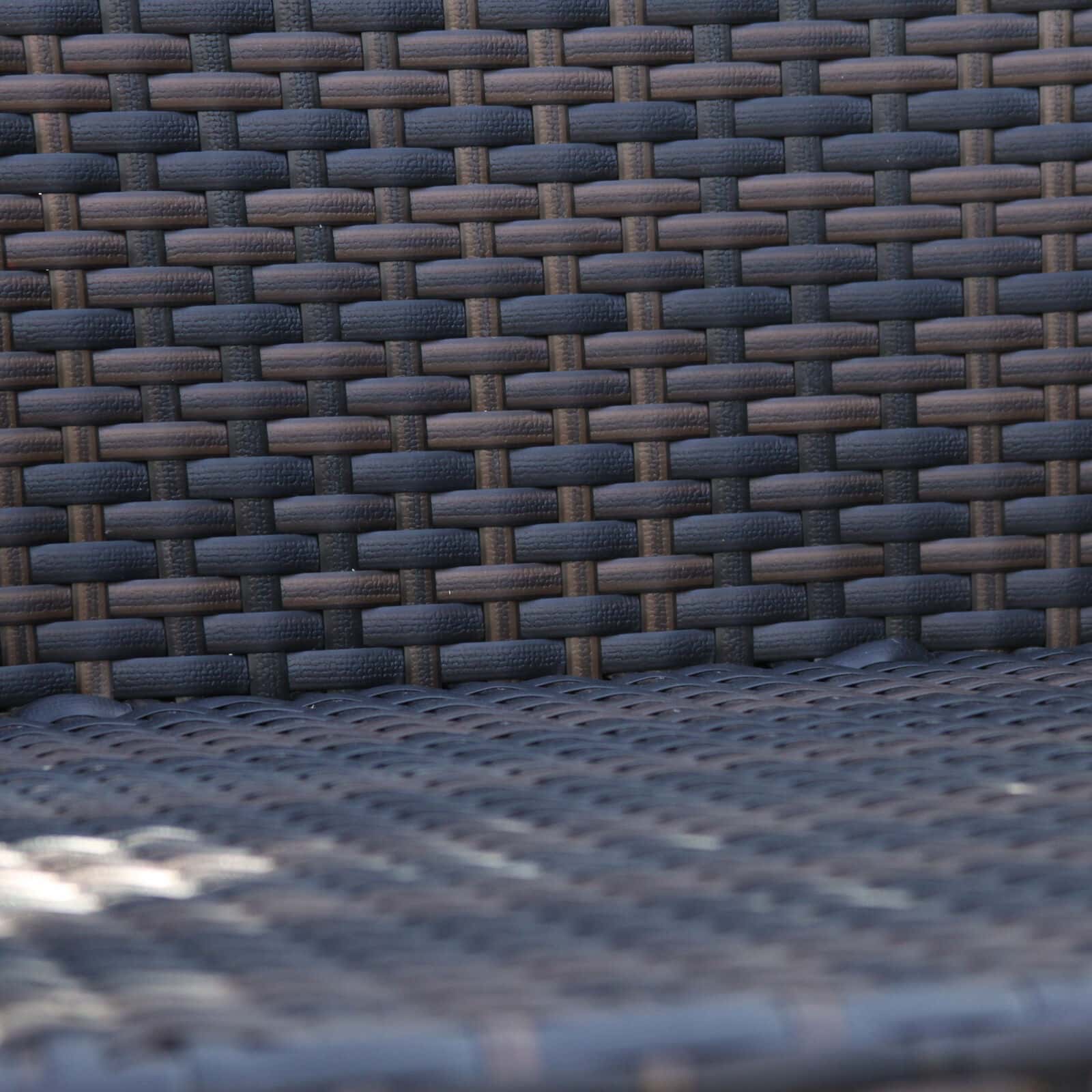 A close up of a wicker chair.
