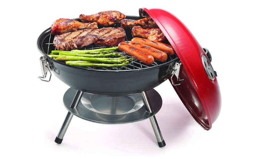 A grill with meat and vegetables on it.