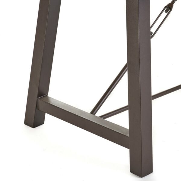 A close up of a table with a metal frame.