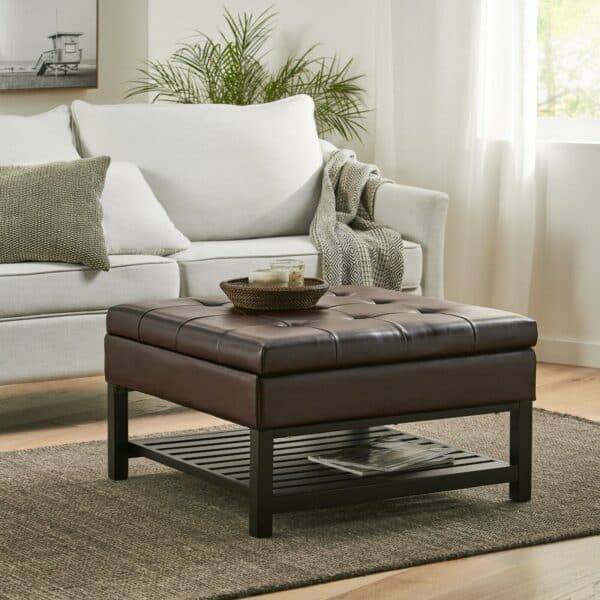 A living room with a coffee table and ottoman.