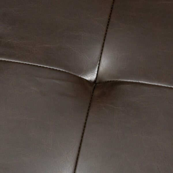 A close up view of a brown leather couch.