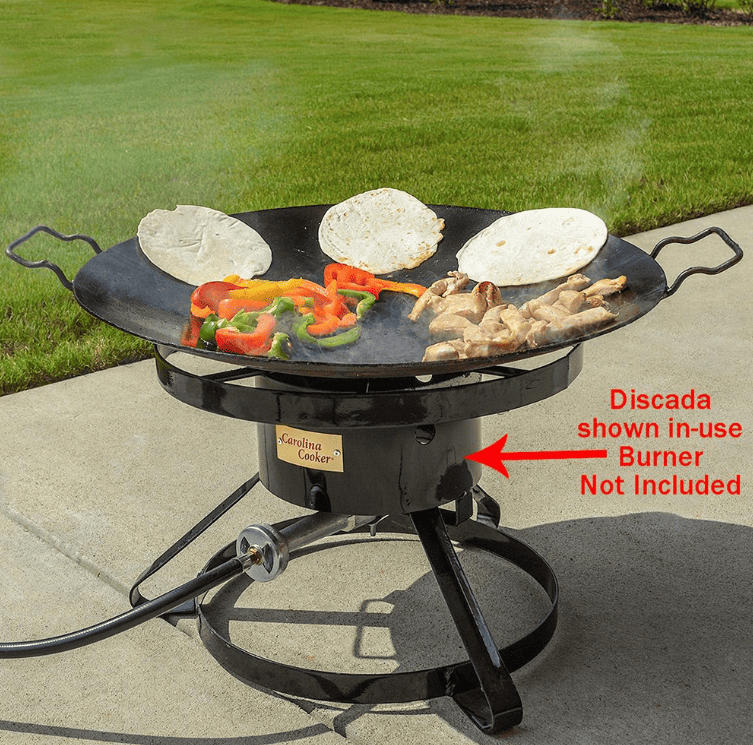 A bbq grill with a hose attached to it.