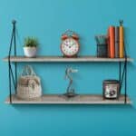 A wall shelf with a clock and other items.