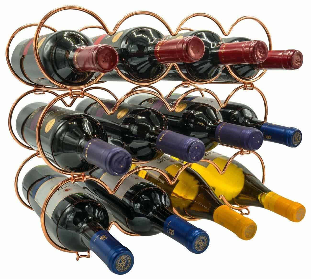 A wine rack with six bottles in it.