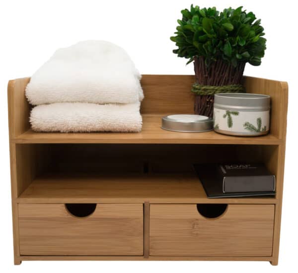 A wooden shelf with two drawers and a plant.