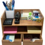 A desk organizer with pens, pencils and a calculator.