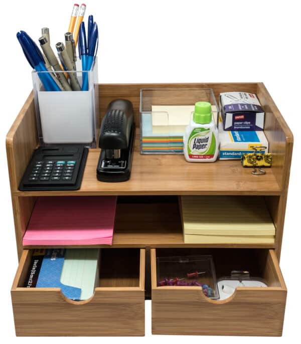 A desk organizer with pens, pencils and a calculator.