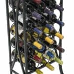 A wine rack with many bottles on it.