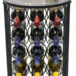 A wine rack with a glass of wine and a bottle of wine.