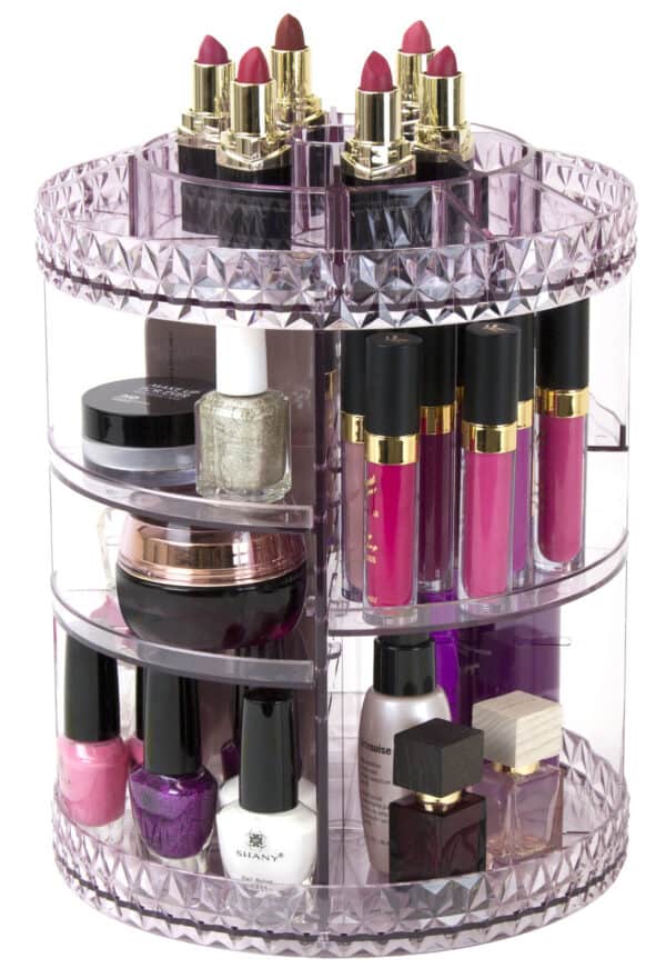 A round makeup organizer with lipsticks and other cosmetics.