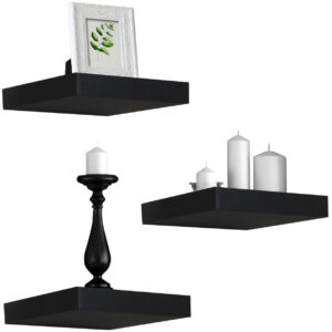 Three black floating shelves with candles and vases.