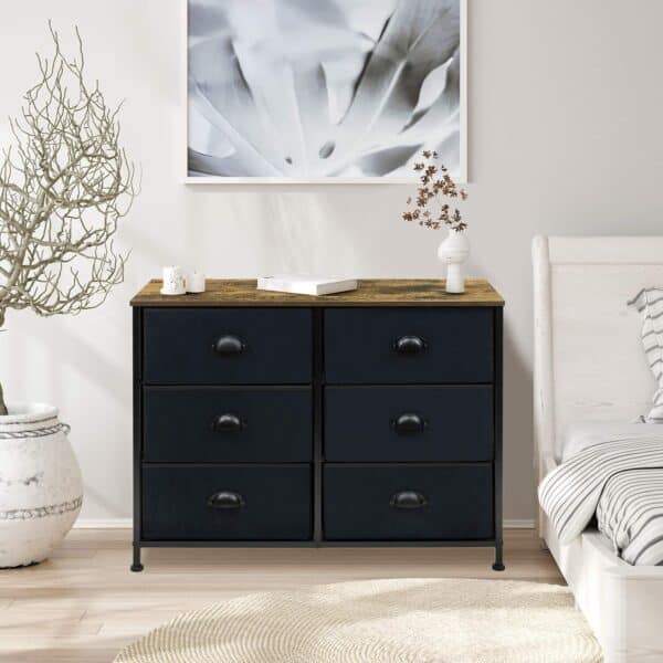 A black dresser with drawers in a bedroom.