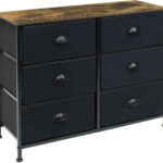 A black and wood dresser with four drawers.