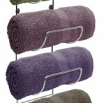 Four towel racks with different colors of towels.