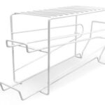 A white metal rack with two shelves on it.