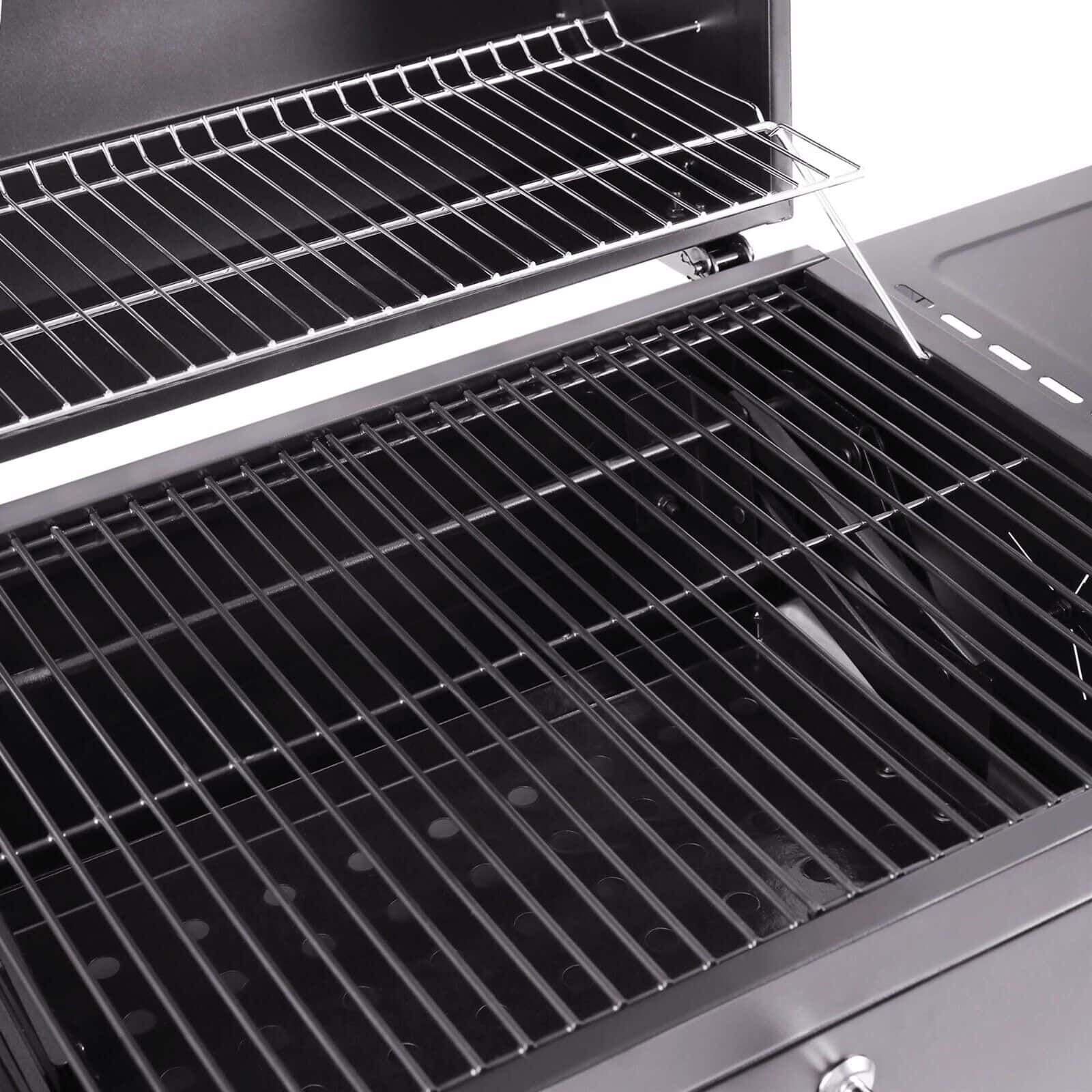A black grill with a grill rack on it.