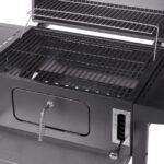 A charcoal grill with a lid and grate.