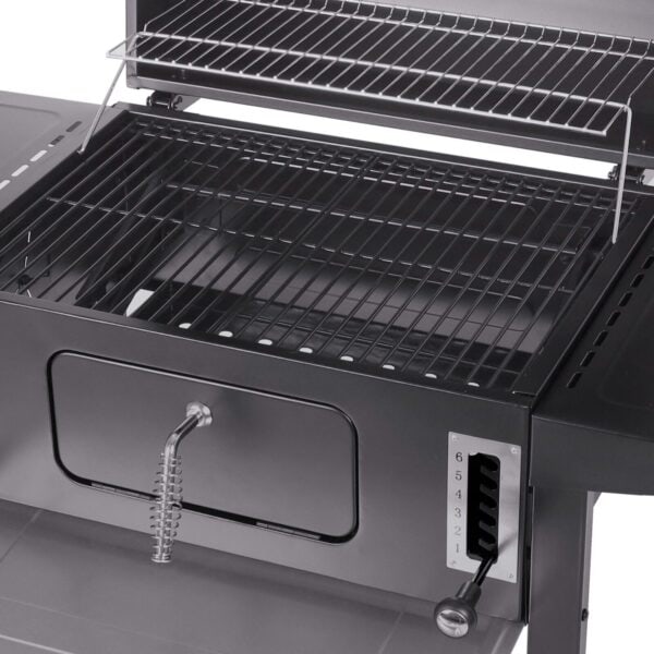 A charcoal grill with a lid and grate.