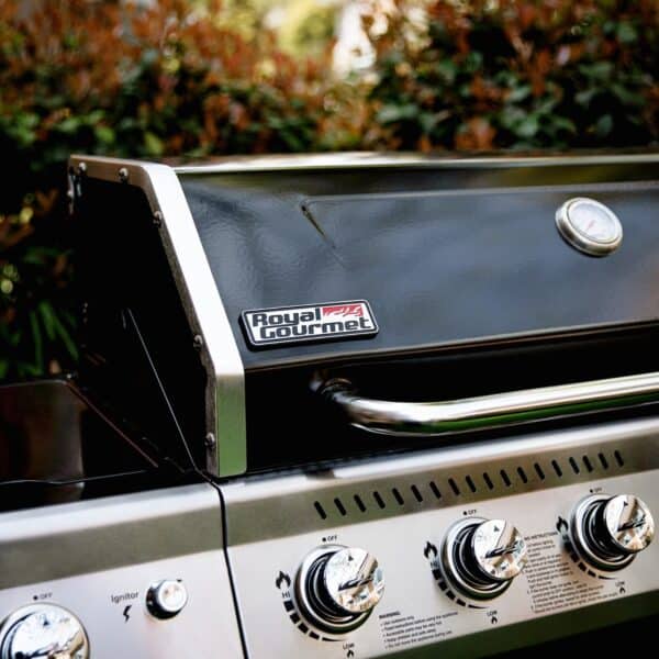A black grill with two burners and a grill grate.