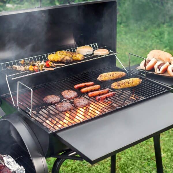 A bbq grill with burgers and hotdogs on it.