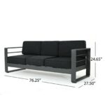 A black sofa with black cushions and measurements.