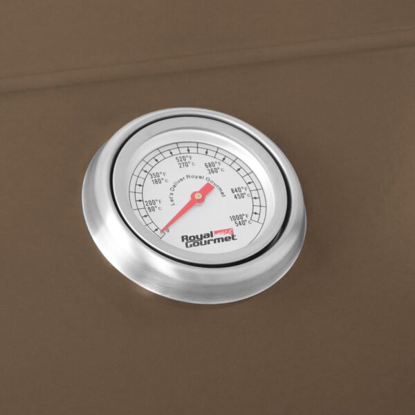 A thermometer is shown on a brown surface.