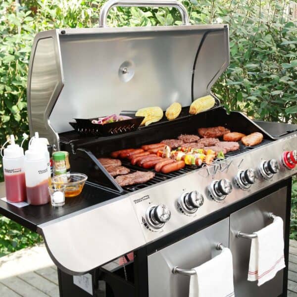 A grill with burgers and hotdogs on it.