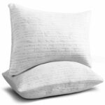 A pair of white pillows on a white background.