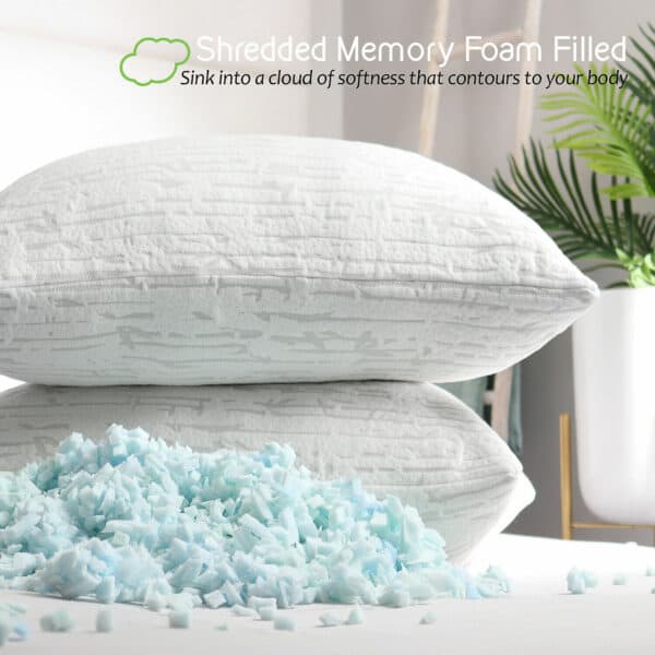 A stack of memory foam filled pillows on a table.