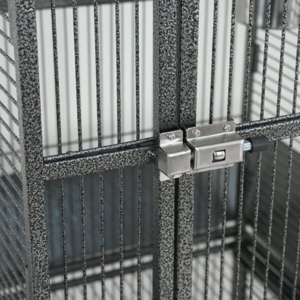 A bird cage with a lock on the door.
