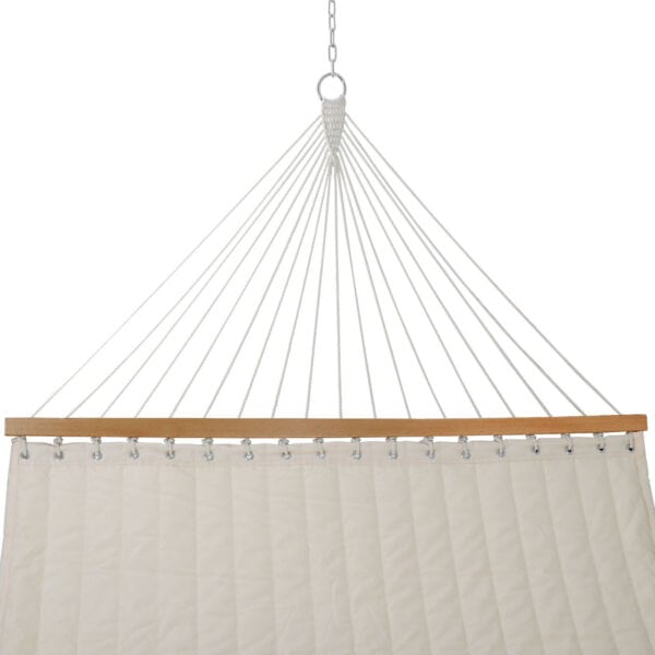A white hammock hanging from a wooden frame.