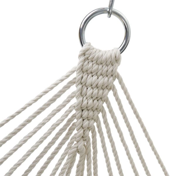 A white rope hammock with a metal ring.